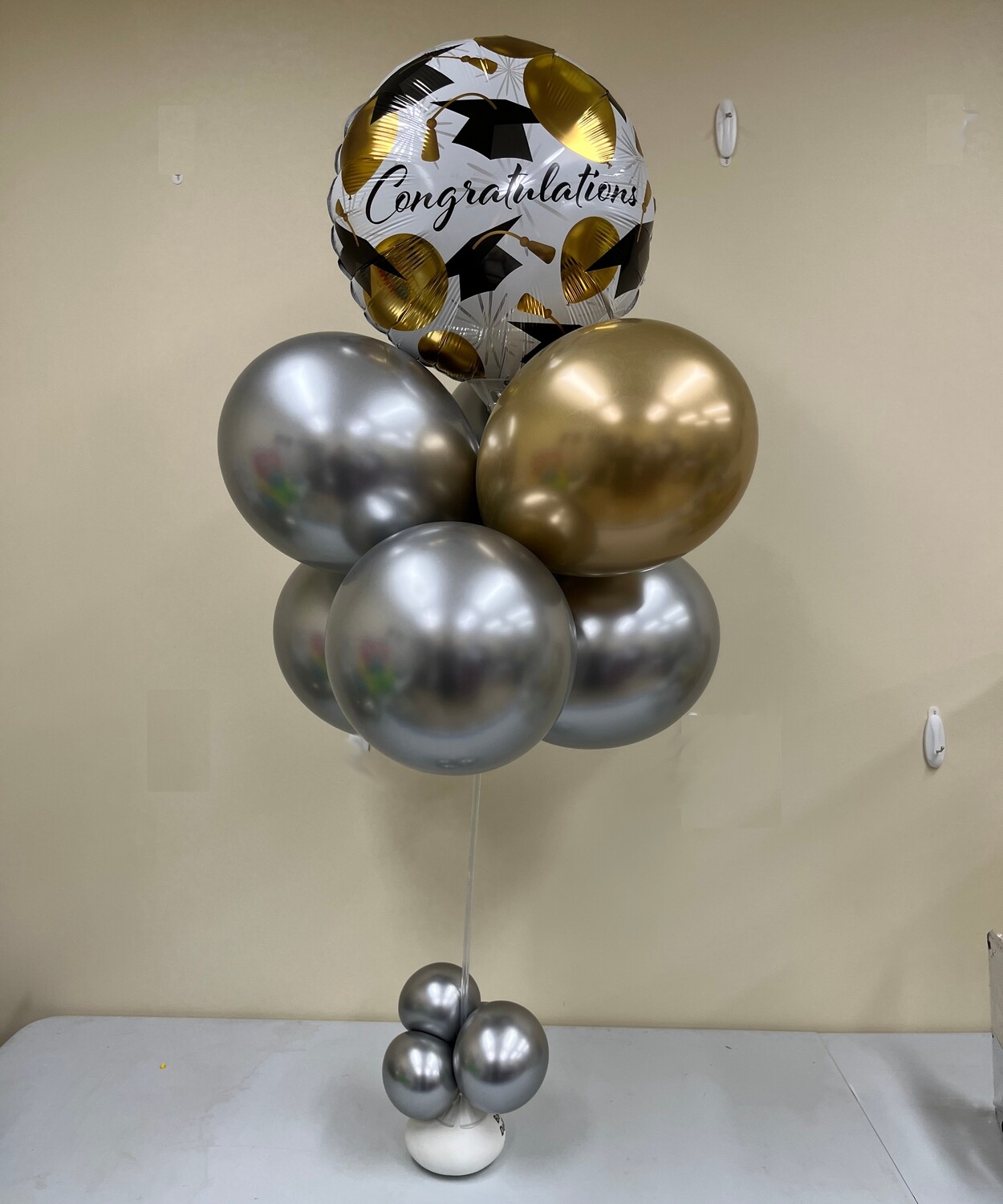 Metallics Grad 7 balloon bouquet delivery in metallics and black