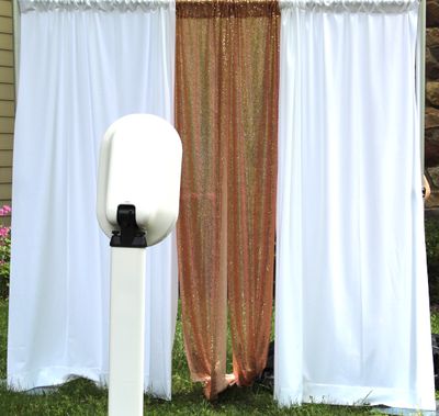 Adult sized deluxe photo booth rental with a staffer