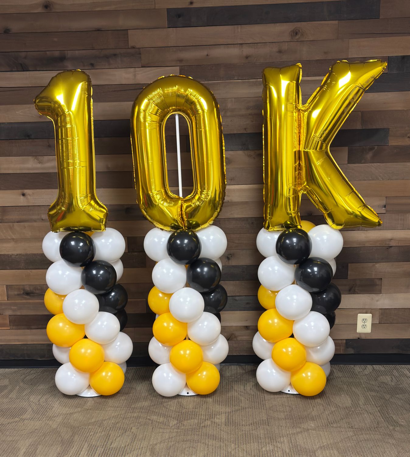 Three balloon columns with letters or numbers