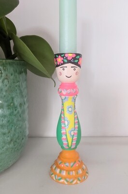 A hand painted Frida inspired candle stick holder