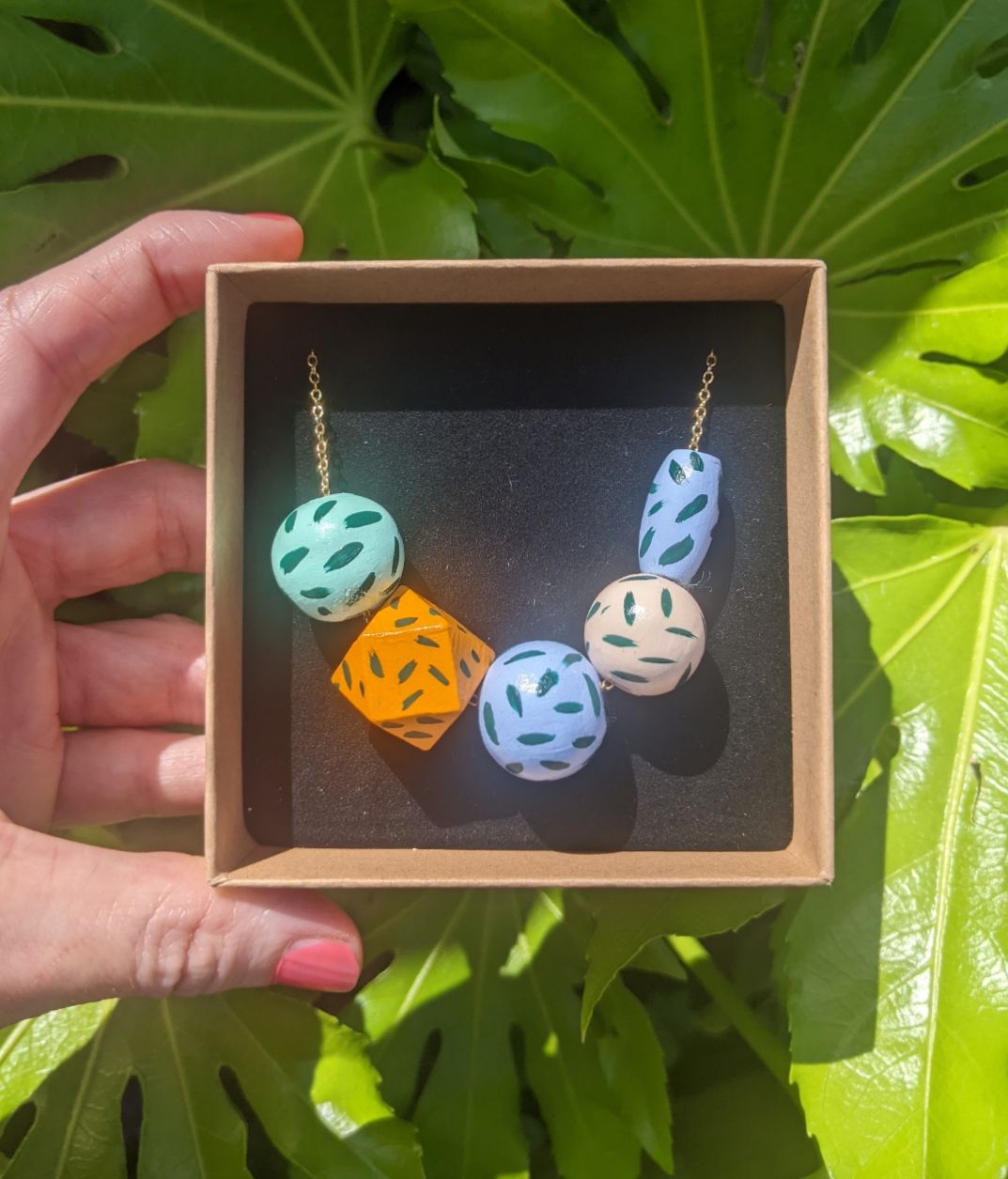 Beaded necklace hand painted pastels and orange
