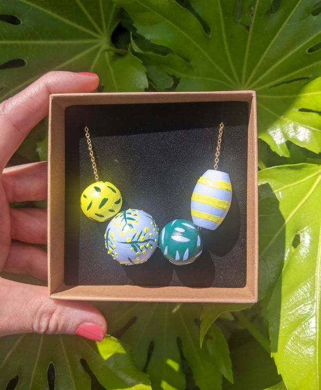 Beaded necklace hand painted yellow and pale blue