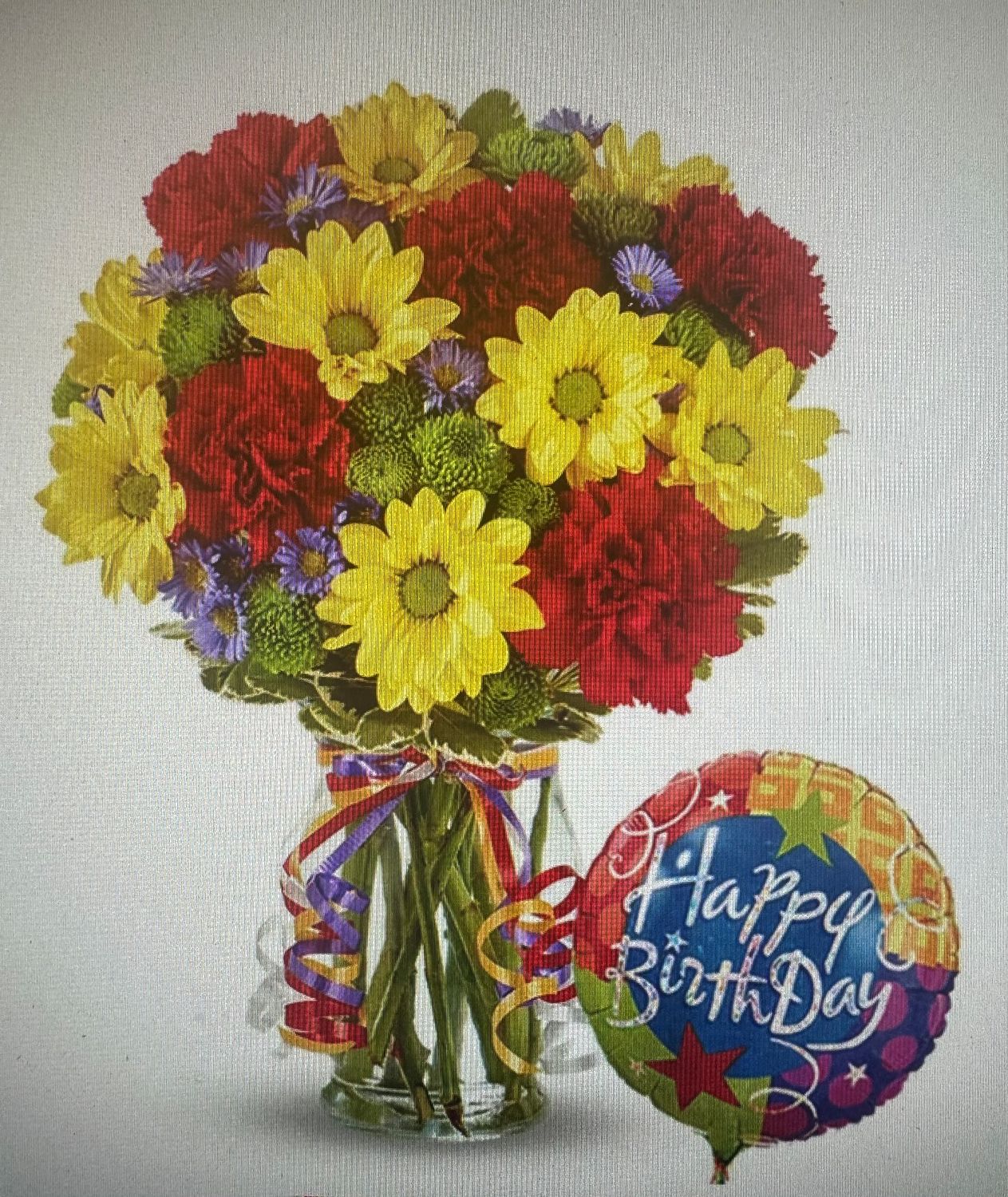 Celebration flowers with birthday balloon