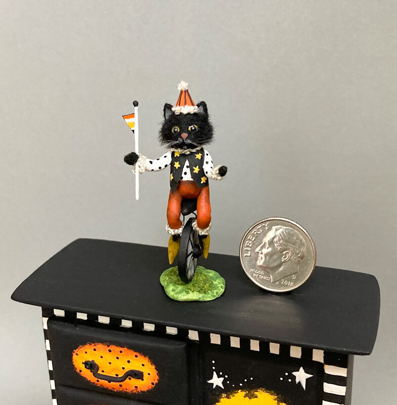 Black Cat On Unicycle