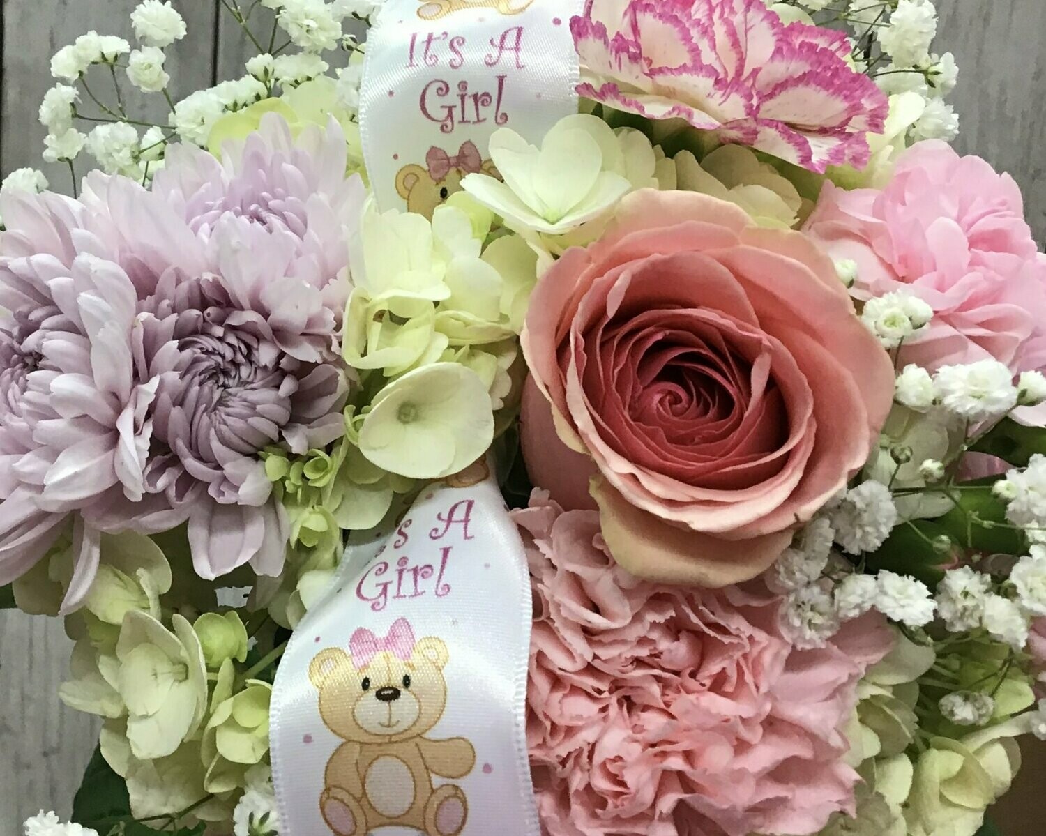 LUXURIOUS Designer’s Choice Arrangement BABY GIRL in PINKS, AND WHITES.  In a baby novelty container. - Item #WFEBT-9016