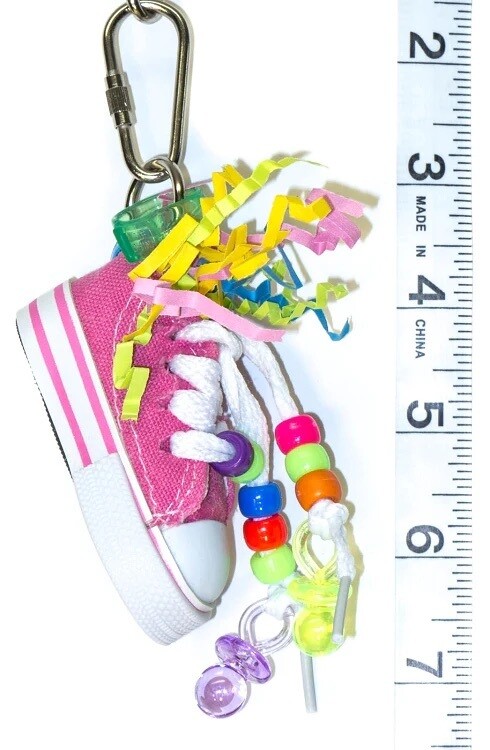 The Beak Sneaker is a cute little toy stuffed full of paper shreds. Birds love to pick and preen at these little canvas and rubber shoes. Approximate Length: 5" - by Cheep Thrills The Beak Sneaker is a cute little toy stuffed full of paper shreds. Birds love to pick and preen at these little canvas and rubber shoes. Approximate Length: 5" - by Cheep Thrills