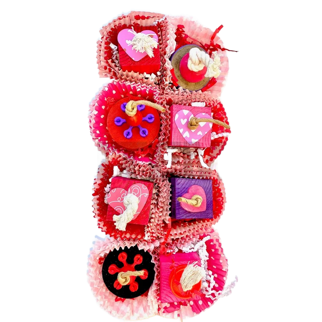 Lucy Valentine - 10.5" x 5.5" cage mount toy with pine cubes, cupcake wrappers, with wooden discs, wood hearts, plastic gears, wooden beads and paper hearts on cotton and craft ropes.