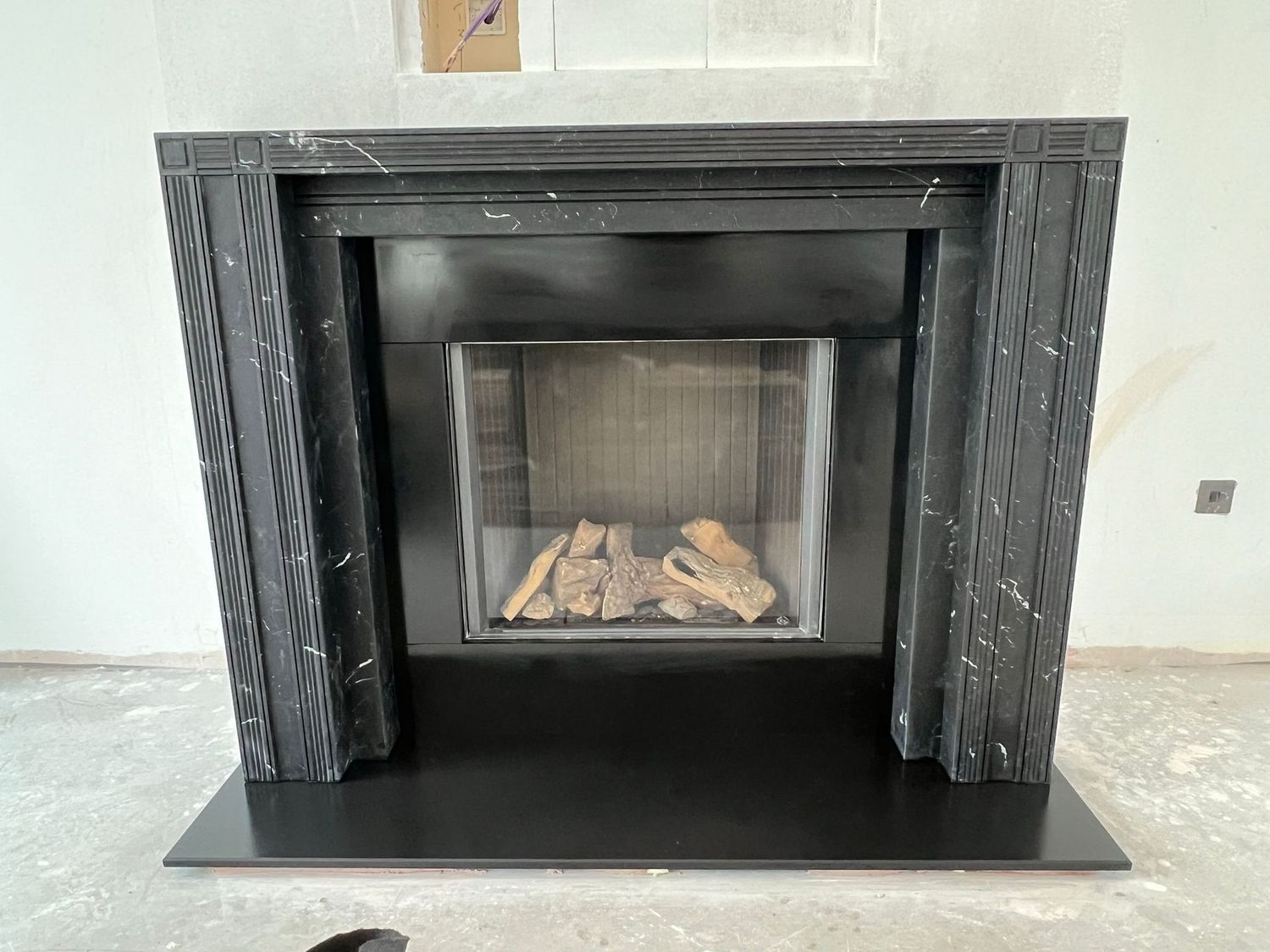 The Soane Fireplace in Nero Marquina Honed