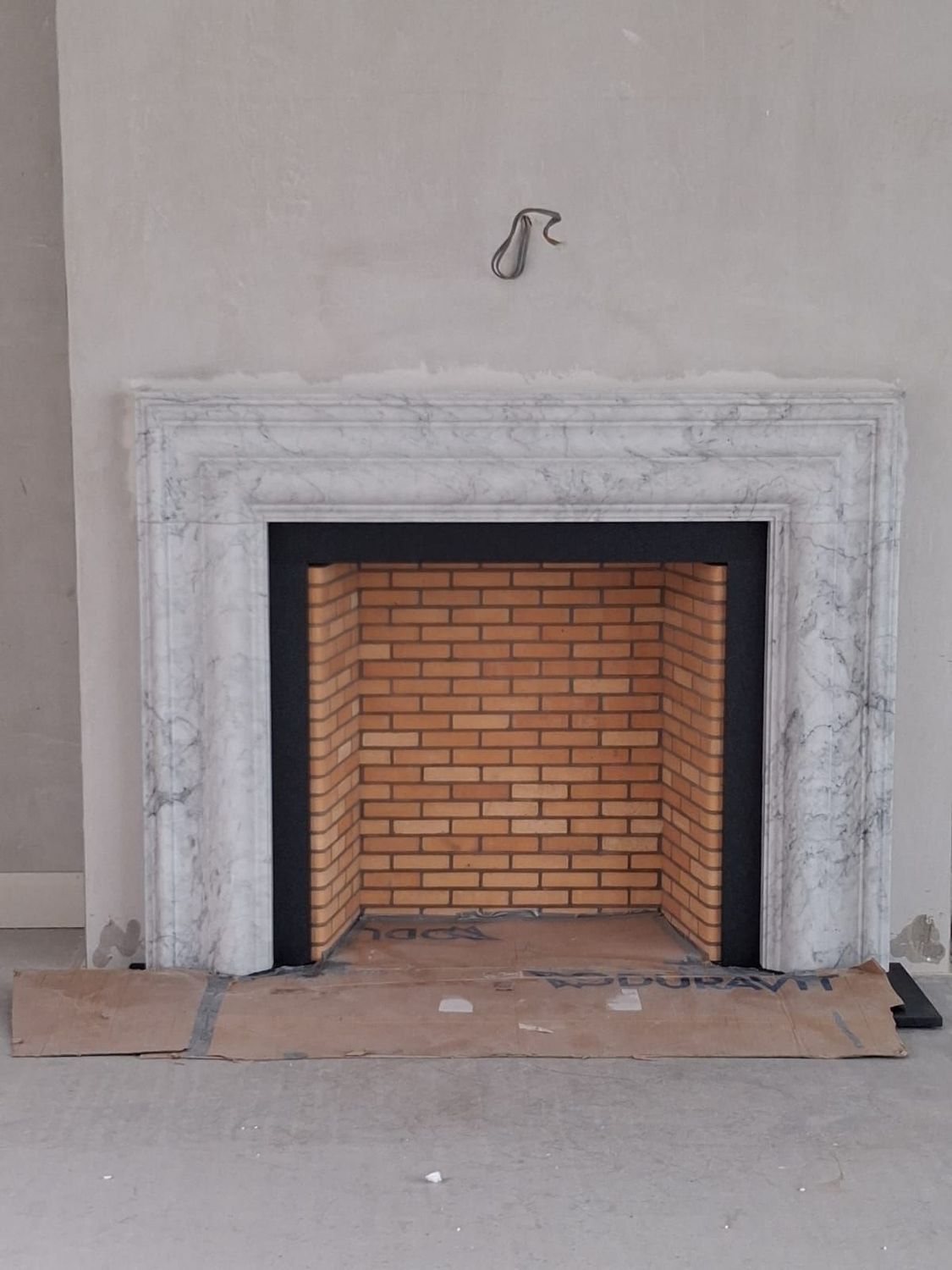 Bolection Fireplace in Arabescato Marble