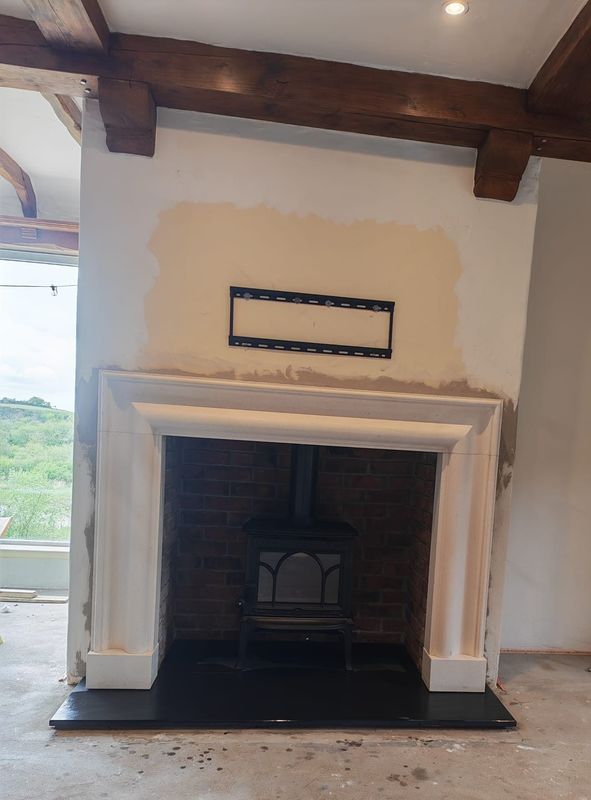 Limestone Bolection Fireplace & Jotul F100 Stove
