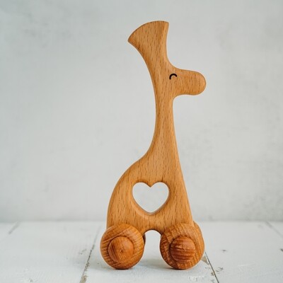 Деревянная игрушка каталка «Стегосариус»
