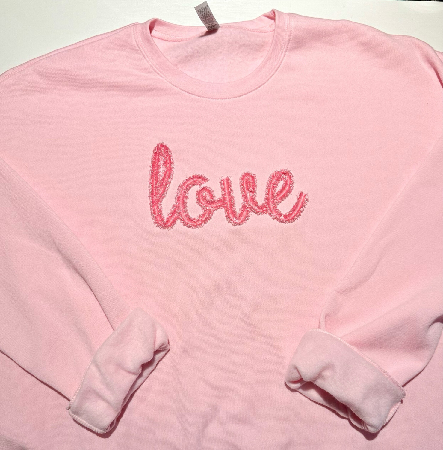 EMBROIDERED FRINGE LOVE SWEATSHIRT