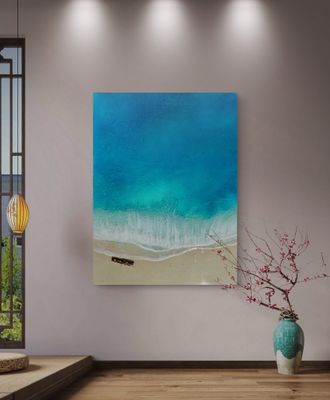 Blue ocean waves rolling under a clear sky, with soft light reflecting across the water in a calm, peaceful coastal scene.