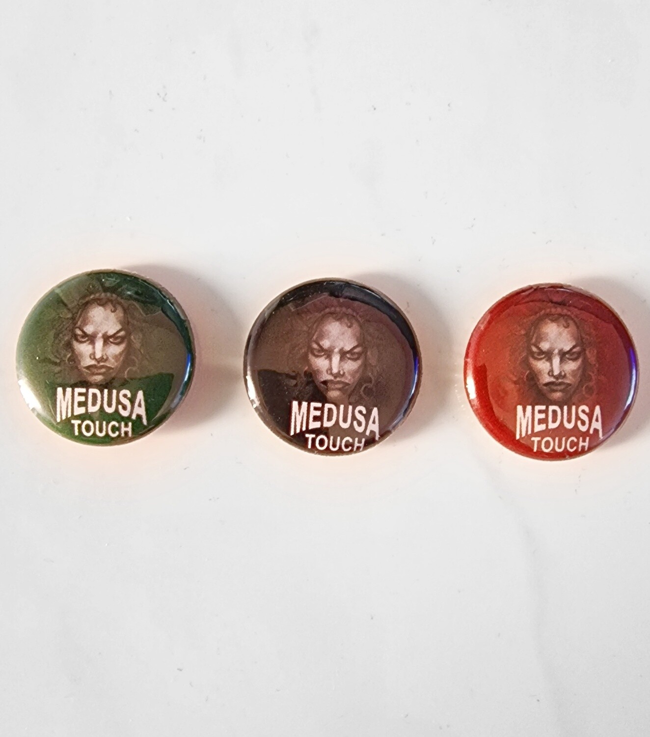 Medusa Touch Pin Badges