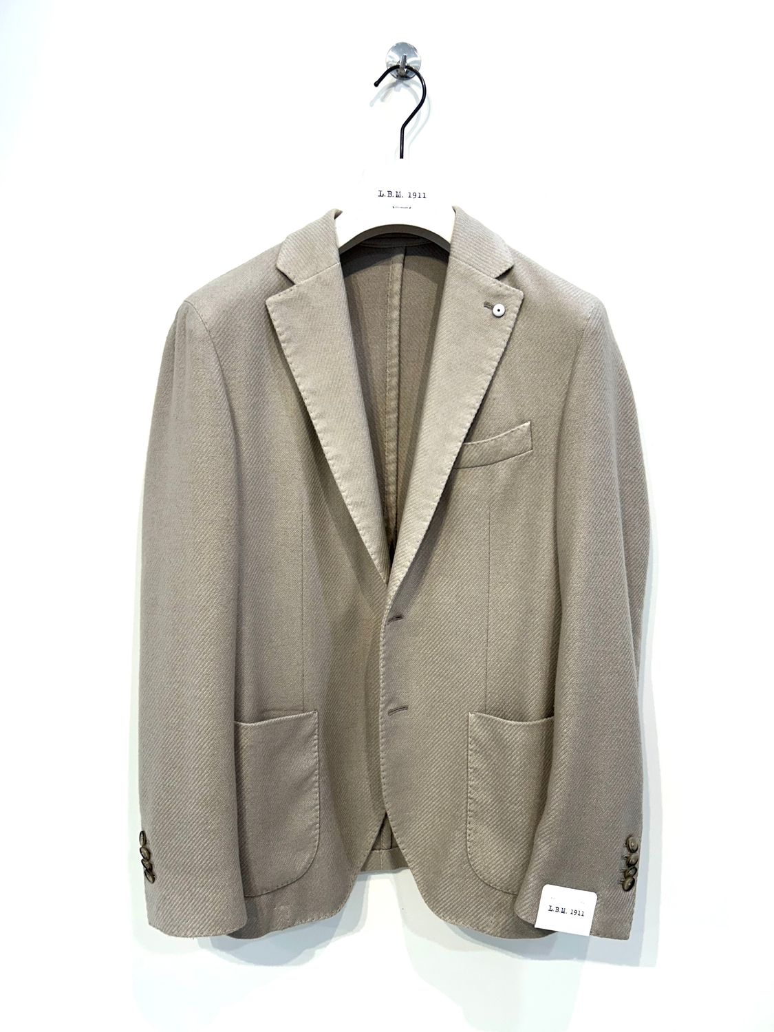 Giacca in stallia di lana operata. Col. Sabbia