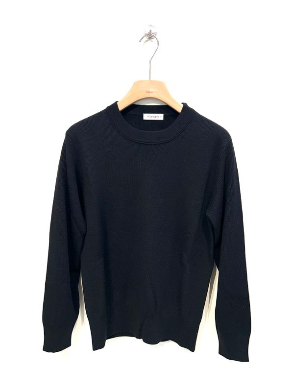 Maglia girocollo in lana merinos lavorazione a costina. Col. Nero