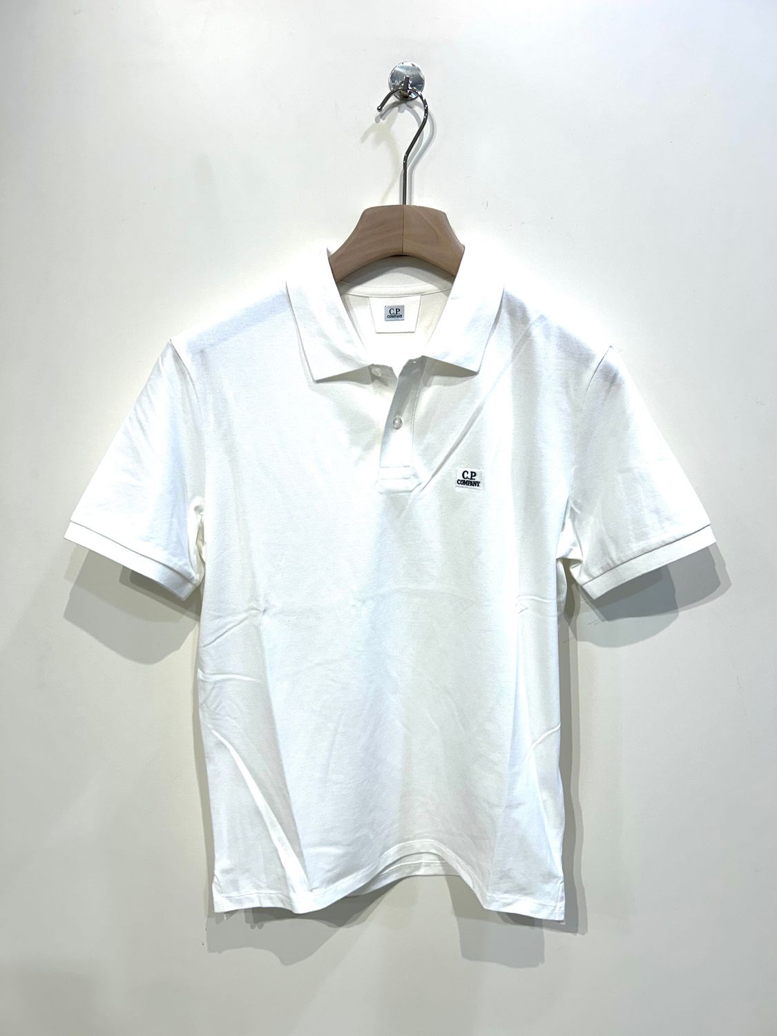 Polo in piquet di cotone strech. Col. Latte