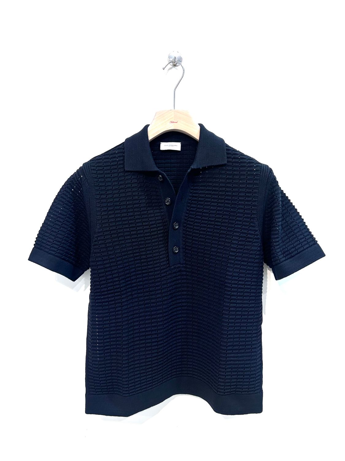 Polo a manica corta in maglia di cotone punto traforo. Col. Nero