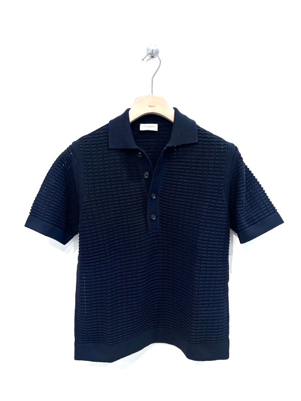 Polo a manica corta in maglia di cotone punto traforo. Col. Nero