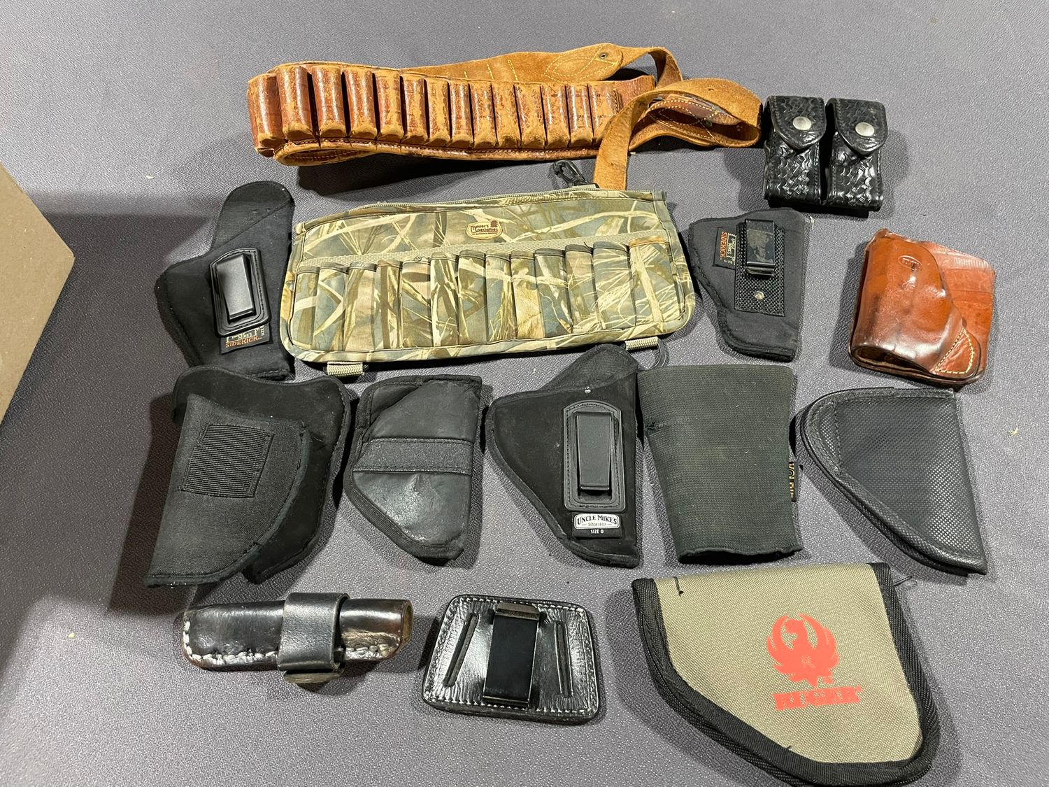 471 Assorted holsters, books &amp; misc.