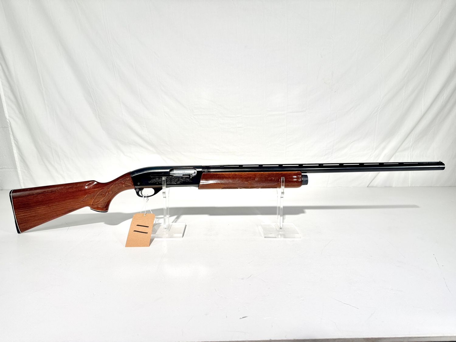 11 REMINGTON 1100 12 GA SEMI AUTO SHOTGUN