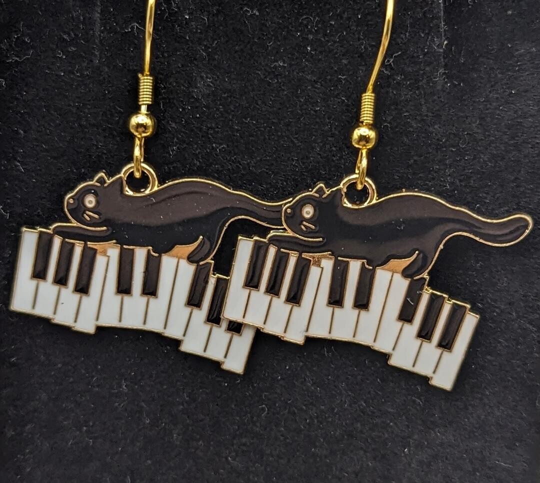 Cats on Piano Keys