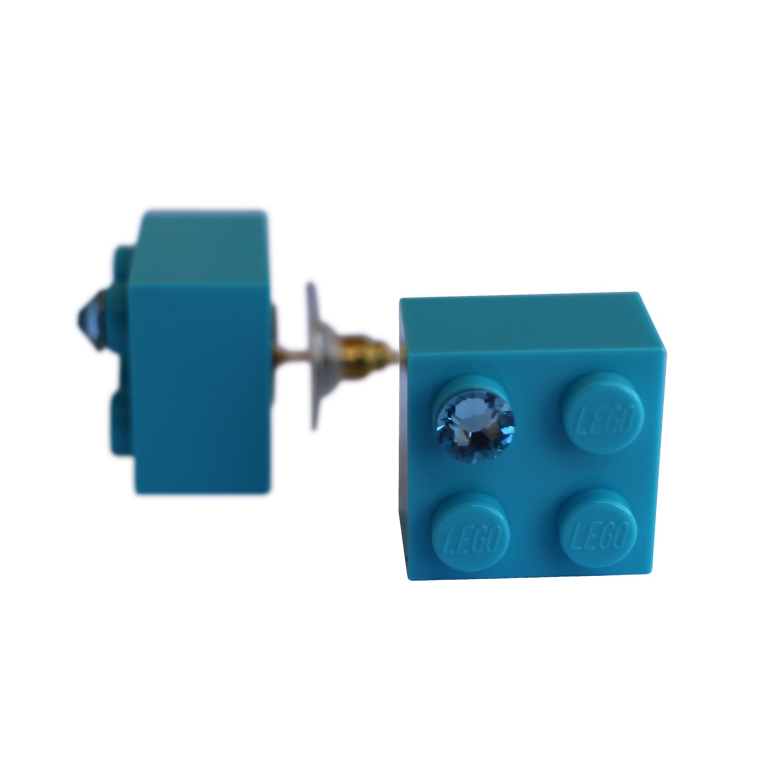 Turquoise Blue LEGO® brick 2x2 with a Blue SWAROVSKI® crystal on a Gold plated stud/silicone back stopper