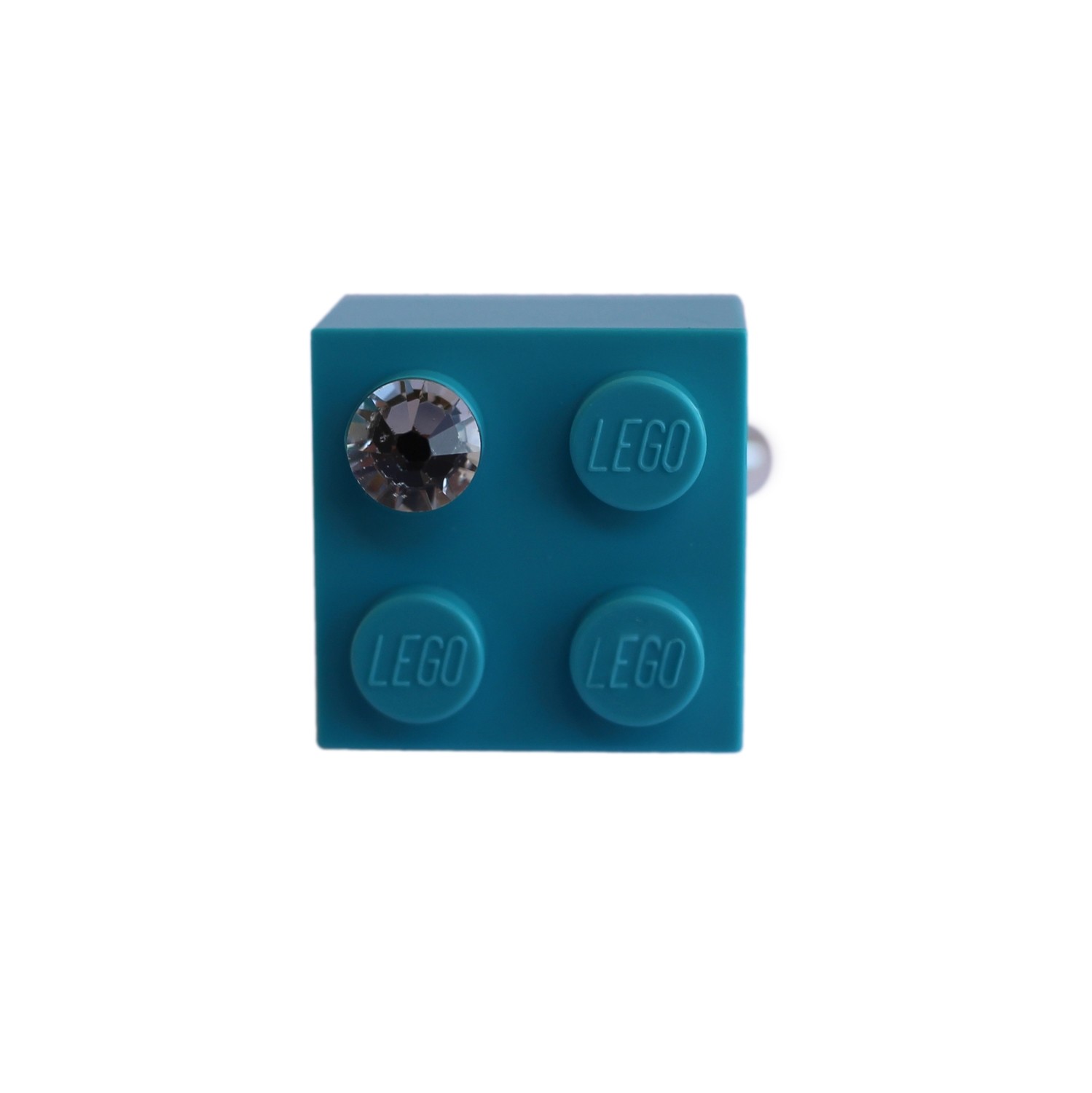 ​Turquoise Blue LEGO® brick 2x2 with a ‘Diamond’ color SWAROVSKI® crystal on a Silver plated adjustable ring finding