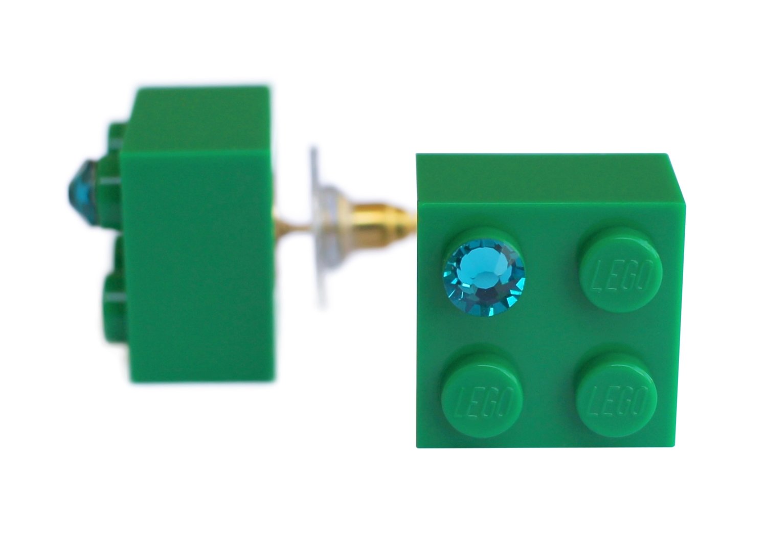 ​Dark Green LEGO® brick 2x2 with a Green SWAROVSKI® crystal on a Gold plated stud/silicone back stopper