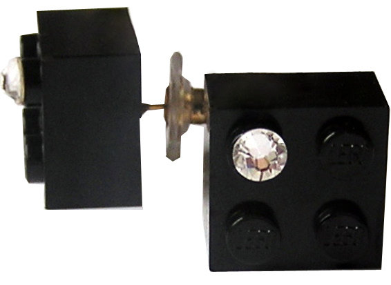 ​Black LEGO® brick 2x2 with a ‘Diamond’ color SWAROVSKI® crystal on a Gold plated stud/silicone back stopper