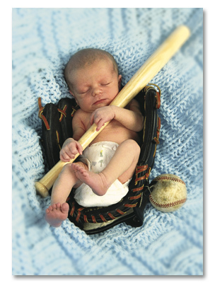 New born in baseball glove