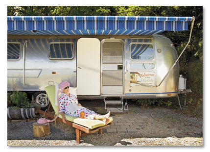 Woman in front of motor home