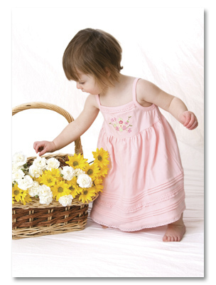 Little girl with basket of flowers