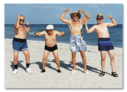 Men flexing on beach
