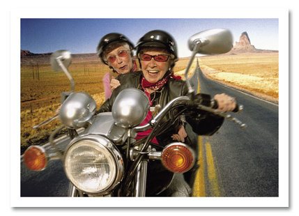 Two senior women on motorcycle