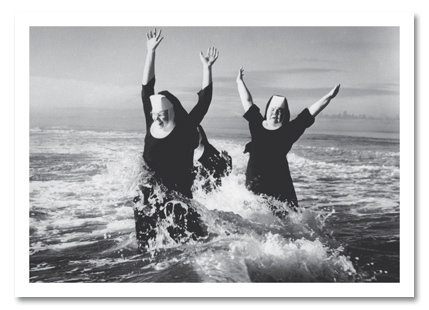 Nuns playing in ocean