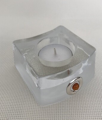 Frosted Glass Candle Holder with Silver and Amber circular motifs.  Irregular shape. Height 4.5 cm.
