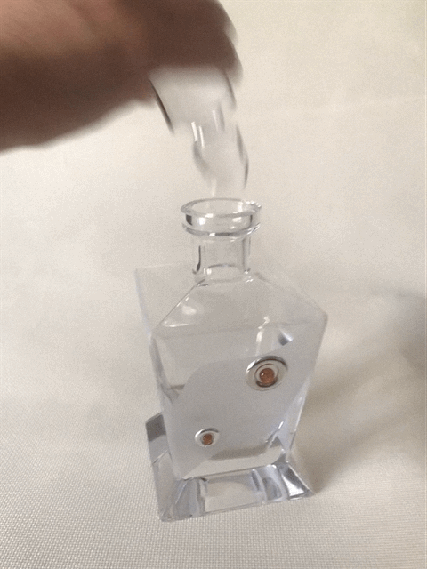 Frosted Glass Decanter with Silver and Amber circular motifs.  Height 26 cm.
