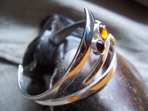Silver bangle with 3 amber beads