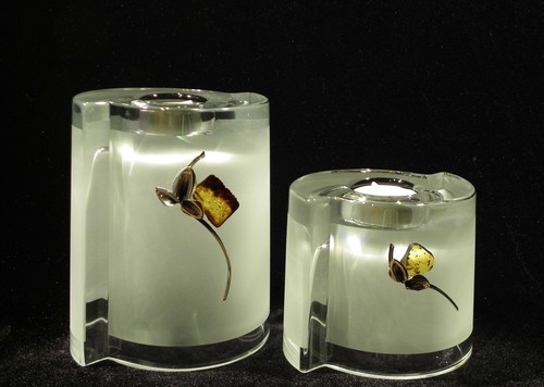 Set of 2 frosted glass vases and candle holders decorated with silver and amber flower motif.