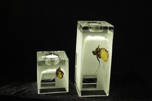 Set of 2 frosted glass vases and candle holders decorated with silver and amber flower motif.