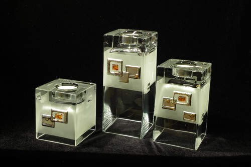 Set of 3 frosted glass vases and candle holders decorated with silver and amber square motif.