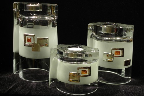 Set of 3 frosted glass vases and candle holders decorated with silver and amber square motif.
