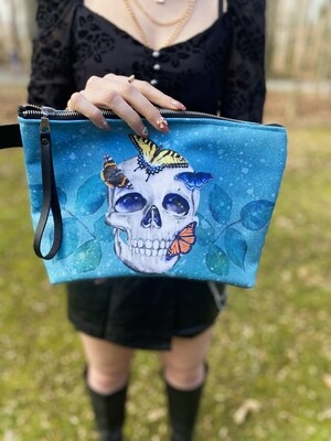 Goth Glam Make up bag featuring roses, a skull, watercolor leaves, and illustrated butterflies.