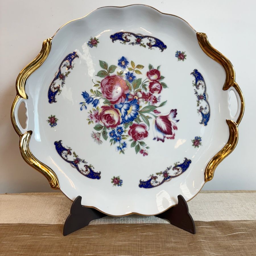 Bandeja redonda con asas de porcelana fina