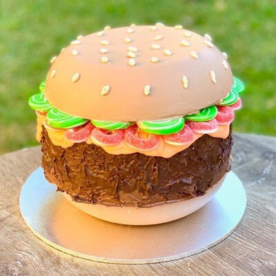 Novelty chocolate smash cakes with fun, custom designs - perfect for birthdays and unique celebrations.
