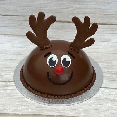 Rudolph reindeer smash cake in Sydney, milk chocolate dome filled with Cadbury party mix, decorated with antlers and red nose