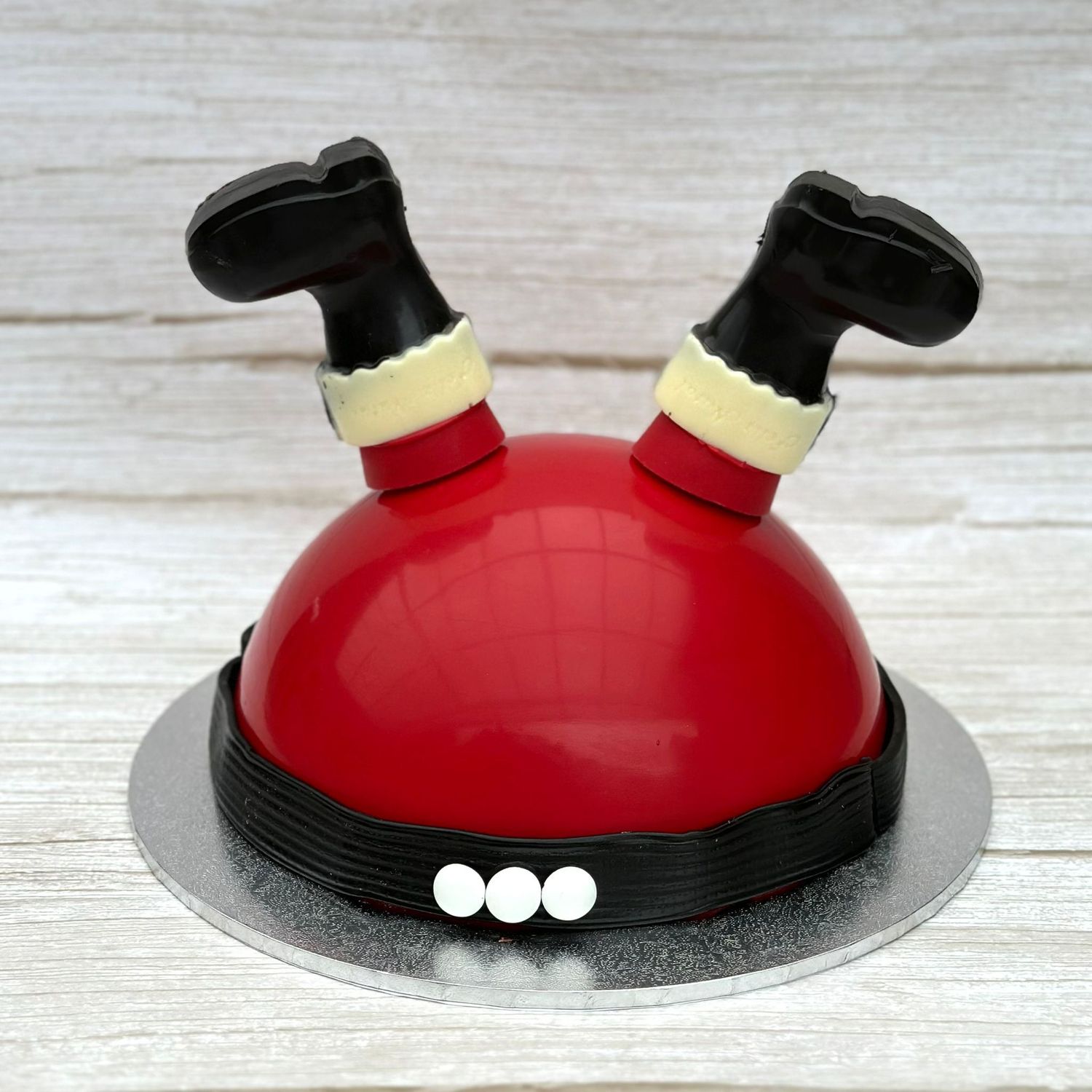 Santa Smash Cake in Sydney, red chocolate dome with chocolate legs and black belt