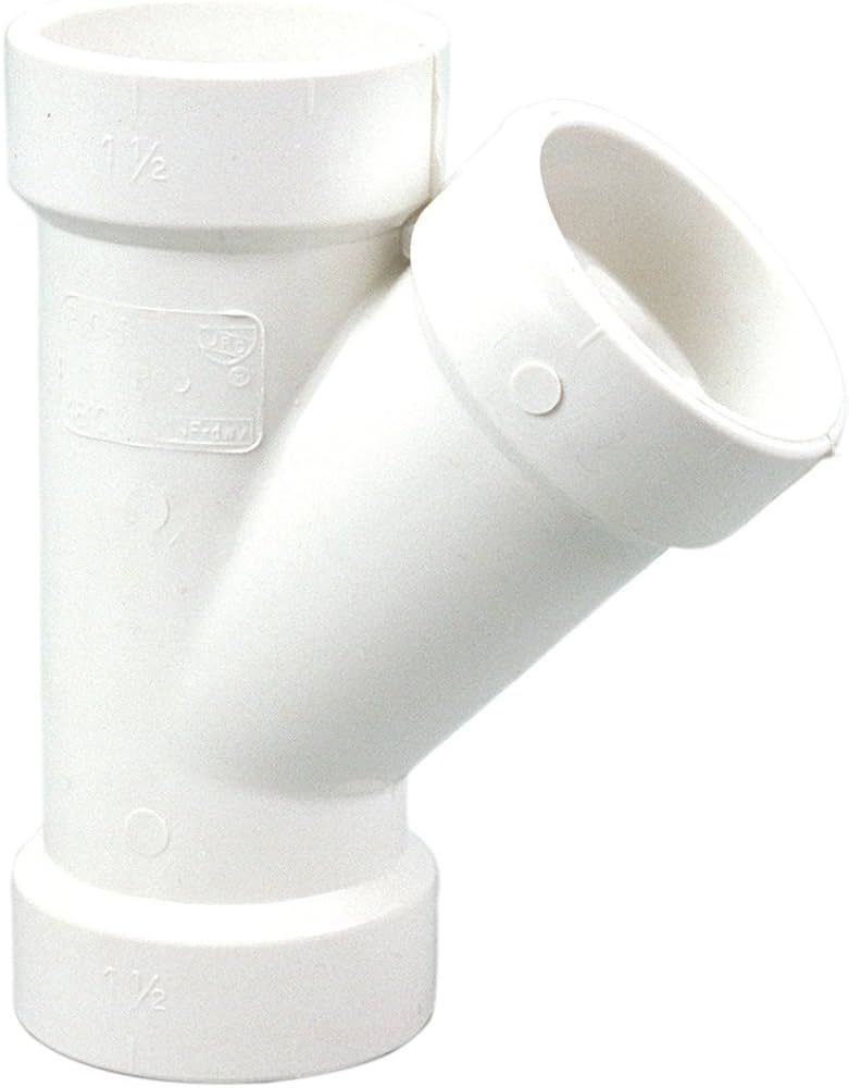 4 inch PVC wye fitting, for branching drain and vent lines.