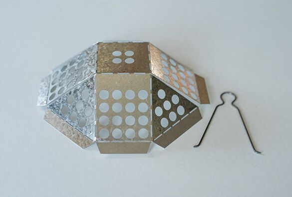 Hexagonal roof drain basket for catching debris on flat roofs.